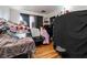 Bedroom with hardwood floors, ample space, and some clutter at 6324 Fairwood Ave, Las Vegas, NV 89107