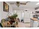 Bright eat-in kitchen featuring ample natural light, simple cabinetry, and an inviting, lived-in atmosphere at 6324 Fairwood Ave, Las Vegas, NV 89107