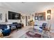 Another view of living room, showing eclectic decor and view to adjacent dining area at 6324 Fairwood Ave, Las Vegas, NV 89107