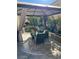 Covered patio with seating area and lush landscaping at 6329 Kitamaya St, North Las Vegas, NV 89031