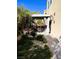 Landscaped backyard with covered patio and seating area at 6329 Kitamaya St, North Las Vegas, NV 89031