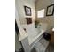 Relaxing bathroom with soaking tub, double vanity, and updated flooring at 6329 Kitamaya St, North Las Vegas, NV 89031