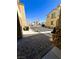 Neat paved courtyard with landscaping and building view at 6329 Kitamaya St, North Las Vegas, NV 89031