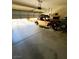 Garage with open door, showing a classic car and storage at 6329 Kitamaya St, North Las Vegas, NV 89031