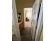 Well-lit hallway with wood-look flooring at 6329 Kitamaya St, North Las Vegas, NV 89031