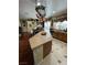 Kitchen island with copper pot rack and hardwood floors at 6329 Kitamaya St, North Las Vegas, NV 89031