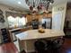 Well-equipped kitchen with an island and copper cookware at 6329 Kitamaya St, North Las Vegas, NV 89031