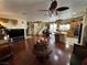 Open floor plan living room with hardwood floors and kitchen view at 6329 Kitamaya St, North Las Vegas, NV 89031