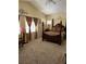 Spacious main bedroom with a large bed and carpeted floor at 6329 Kitamaya St, North Las Vegas, NV 89031