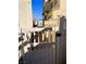 Side yard access with a white vinyl fence and gate at 6329 Kitamaya St, North Las Vegas, NV 89031
