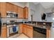 Spacious kitchen with stainless steel appliances and granite counters at 708 Bridgeford Ct, Henderson, NV 89011