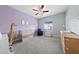 Charming Bedroom with light purple walls and crib at 7544 Nicklin St, Las Vegas, NV 89143