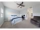 Bright bedroom with ceiling fan and gray carpeting at 7544 Nicklin St, Las Vegas, NV 89143