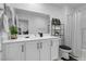 Modern bathroom with white cabinets and a black and white shower curtain at 779 Omaggio Pl, Henderson, NV 89011