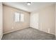 Spacious bedroom featuring carpet floors and sliding door closet at 7808 License St, Las Vegas, NV 89131