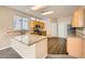 Kitchen with light wood cabinets, granite countertops, and stainless steel appliances at 7808 License St, Las Vegas, NV 89131