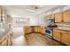 Modern kitchen featuring stainless steel appliances and wood cabinets at 7808 License St, Las Vegas, NV 89131