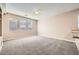 Bright and airy living room with large windows and neutral walls at 7808 License St, Las Vegas, NV 89131