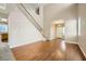 Living room with hardwood floors, high ceilings, and a staircase at 7808 License St, Las Vegas, NV 89131
