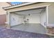 Two-car garage with epoxy flooring and storage at 8115 Lennox View Ln, Las Vegas, NV 89113