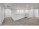 Open loft area with neutral carpet and hallway access at 824 Bluebird Hill Ave, North Las Vegas, NV 89084