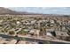 Aerial view of a residential community with desert landscape at 8716 Purple Wisteria St, Las Vegas, NV 89131