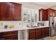 Kitchen features stainless steel dishwasher and white countertops at 8716 Purple Wisteria St, Las Vegas, NV 89131