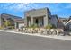 Contemporary house with a two-car garage and stone facade at 985 Edinburgh Fields Ct, Las Vegas, NV 89138