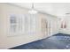 Bright dining room with blue carpet, shutters and sliding doors at 9869 Pioneer Ave, Las Vegas, NV 89117