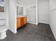 Bathroom with double vanity, shower, and linen shelves at 10375 Beallsville St, Las Vegas, NV 89141