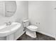 Small bathroom with pedestal sink and toilet at 10375 Beallsville St, Las Vegas, NV 89141