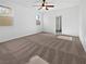 Spacious bedroom with neutral carpeting and large windows at 10375 Beallsville St, Las Vegas, NV 89141