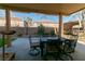 Outdoor patio features a dining area and lush landscaping at 10744 Balsam Creek Ave, Las Vegas, NV 89144