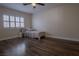 Bright bedroom with wood floors and a ceiling fan at 10744 Balsam Creek Ave, Las Vegas, NV 89144