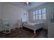 Charming bedroom with hardwood floors and a rocking chair at 10744 Balsam Creek Ave, Las Vegas, NV 89144