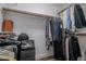 Well-organized walk-in closet with hanging rods and shelving at 10744 Balsam Creek Ave, Las Vegas, NV 89144