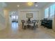 Elegant dining area with a round table and access to the living room at 10744 Balsam Creek Ave, Las Vegas, NV 89144