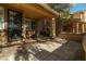 Covered front porch with seating area and a view of the neighborhood at 10744 Balsam Creek Ave, Las Vegas, NV 89144