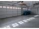 Clean and organized two-car garage with epoxy floor at 10744 Balsam Creek Ave, Las Vegas, NV 89144