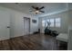 Bright home gym with wood floors, exercise equipment, and natural light at 10744 Balsam Creek Ave, Las Vegas, NV 89144