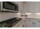 Stainless steel appliances and granite countertops in this modern kitchen at 10744 Balsam Creek Ave, Las Vegas, NV 89144