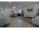 Living room with seating area, coffee table, and large artwork at 10744 Balsam Creek Ave, Las Vegas, NV 89144