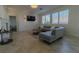 Living Room with sectional sofa, fireplace and large windows at 10744 Balsam Creek Ave, Las Vegas, NV 89144