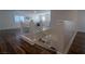 Upstairs hallway with hardwood flooring and modern staircase at 10744 Balsam Creek Ave, Las Vegas, NV 89144