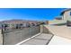 Private balcony with mountain views and a metal railing at 11377 Gravitation Dr # 0, Las Vegas, NV 89135