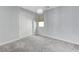 Spacious bedroom with gray walls, carpet, and a chandelier at 11377 Gravitation Dr, Las Vegas, NV 89135