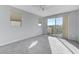 Spacious bedroom with balcony access and ceiling fan at 11377 Gravitation Dr # 0, Las Vegas, NV 89135