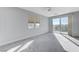 Bright bedroom with balcony access and ceiling fan at 11377 Gravitation Dr # 0, Las Vegas, NV 89135