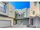 Modern townhome community with attached garages and paved courtyard at 11377 Gravitation Dr, Las Vegas, NV 89135