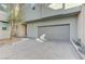 Gray attached garage with paved driveway at 11377 Gravitation Dr, Las Vegas, NV 89135